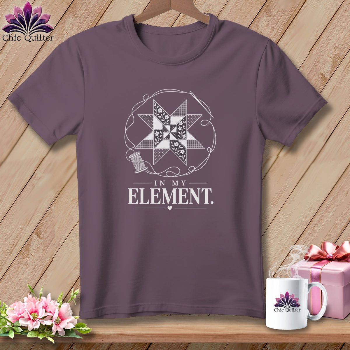Purple t-shirt with quilt block design and "In My Element" text.