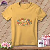 Gold crewneck t-shirt featuring a centered graphic of colorful wooden thread spools.