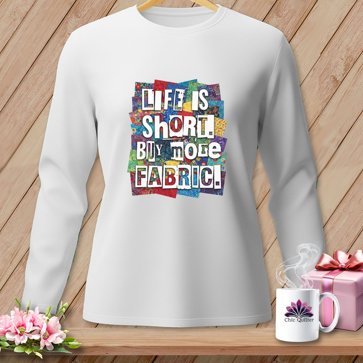 White long-sleeve shirt with "Life is short. Buy more fabric!" graphic.