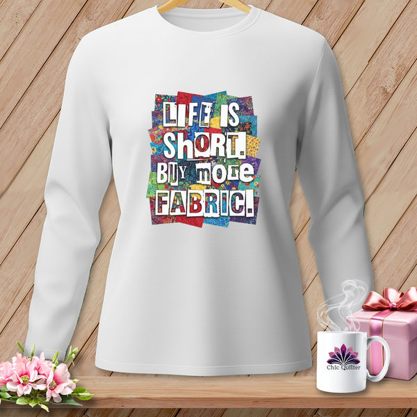 White long-sleeve shirt with "Life is short. Buy more fabric!" graphic.