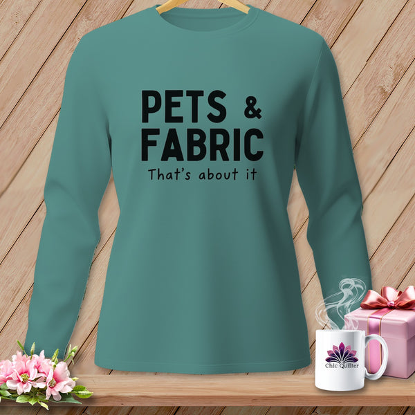 Teal long-sleeve shirt with "PETS & FABRIC" text and a mug.