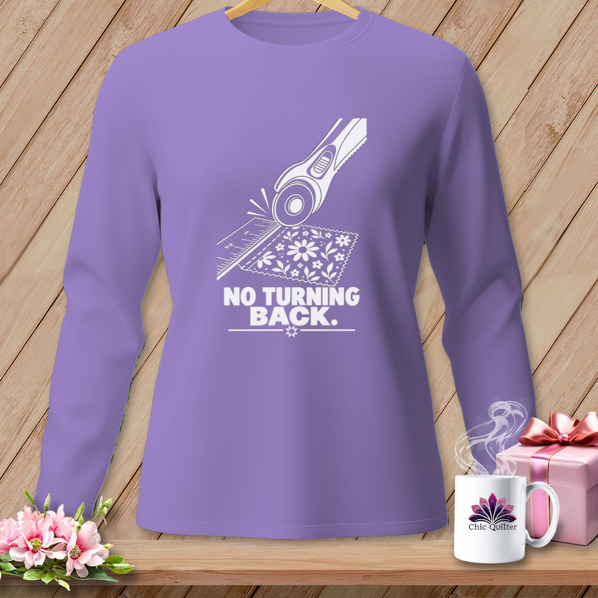 Purple long-sleeve shirt with a rotary cutter graphic and "NO TURNING BACK" text.