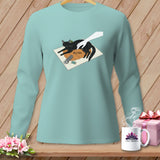 Light blue long-sleeve shirt with a graphic of a black cat lounging on a pumpkin with the word 