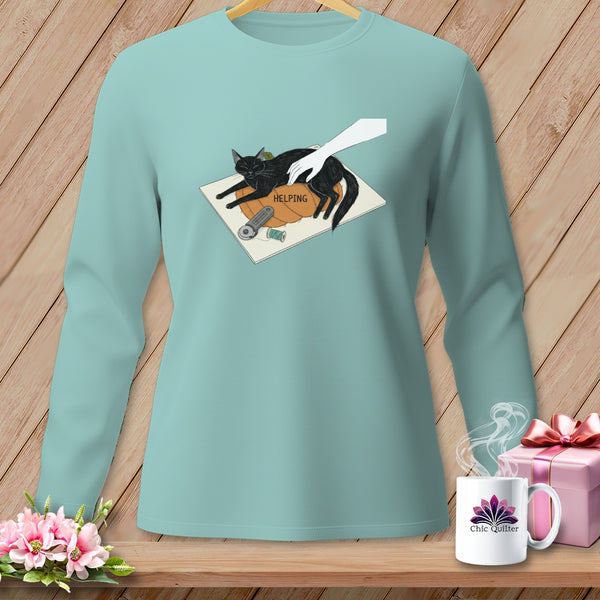 Light blue long-sleeve shirt with a graphic of a black cat lounging on a pumpkin with the word "HELPING."