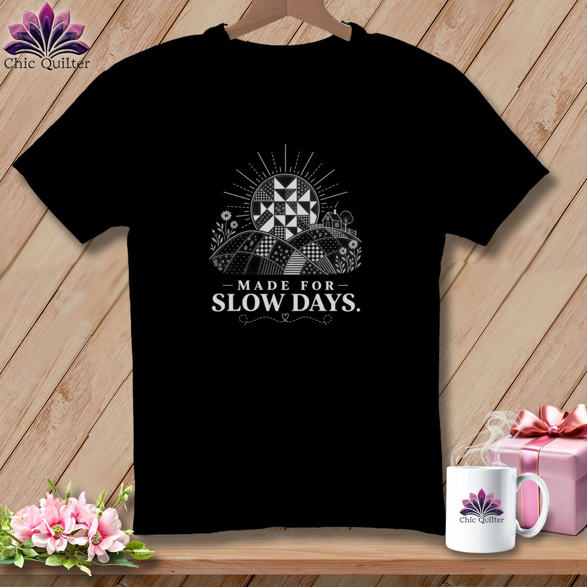 Black t-shirt with "Made for Slow Days" text and quilt-like landscape design.