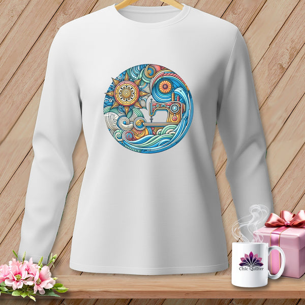 White long-sleeve shirt with circular sewing machine and sun design.