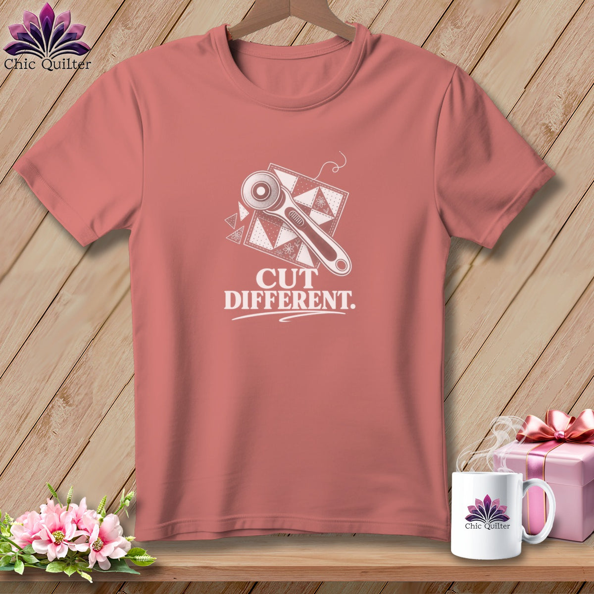 Coral t-shirt with rotary cutter and quilt pattern graphic, reads "Cut Different."