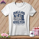 White t-shirt with a blue graphic reading Dallas Quilter, fabric bolts, and a measuring tape.