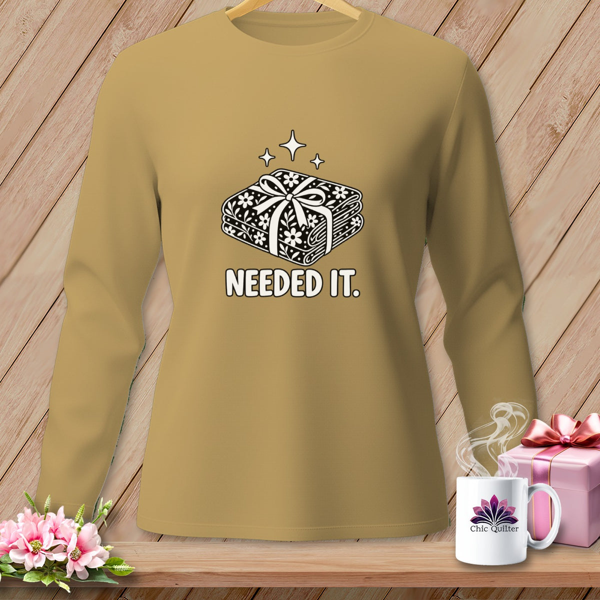Long sleeve shirt with stacked fabric pattern and "Needed It." text.