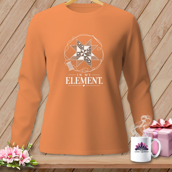 Orange long-sleeve shirt with a quilt star graphic and text "IN MY ELEMENT".