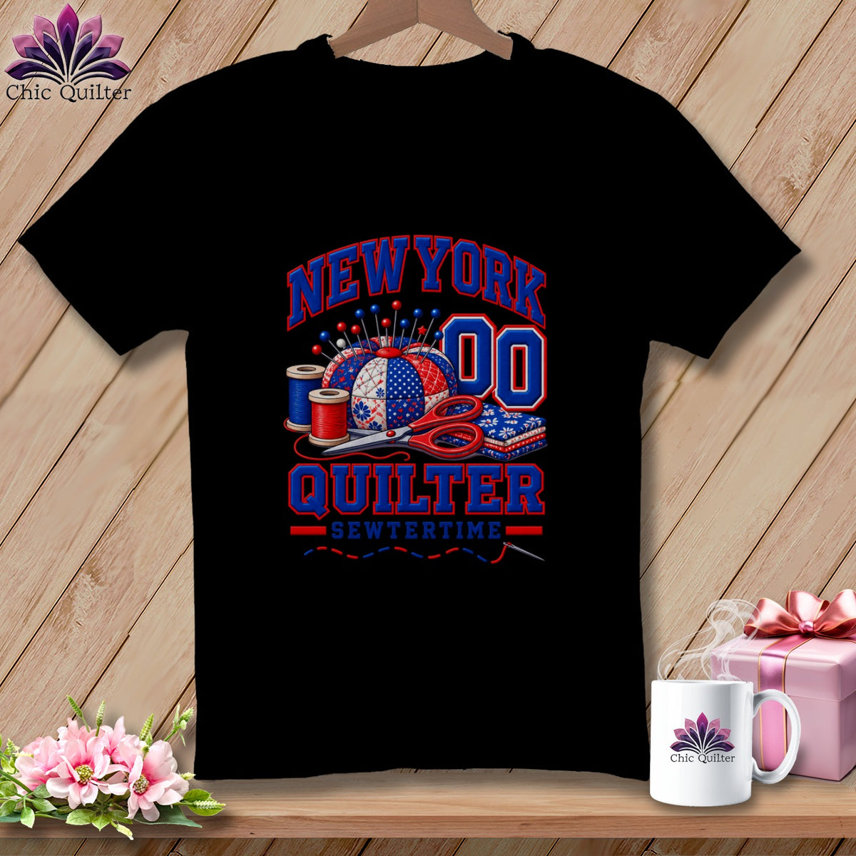 Black t-shirt featuring a New York Quilter design with red, white, and blue sewing motifs.