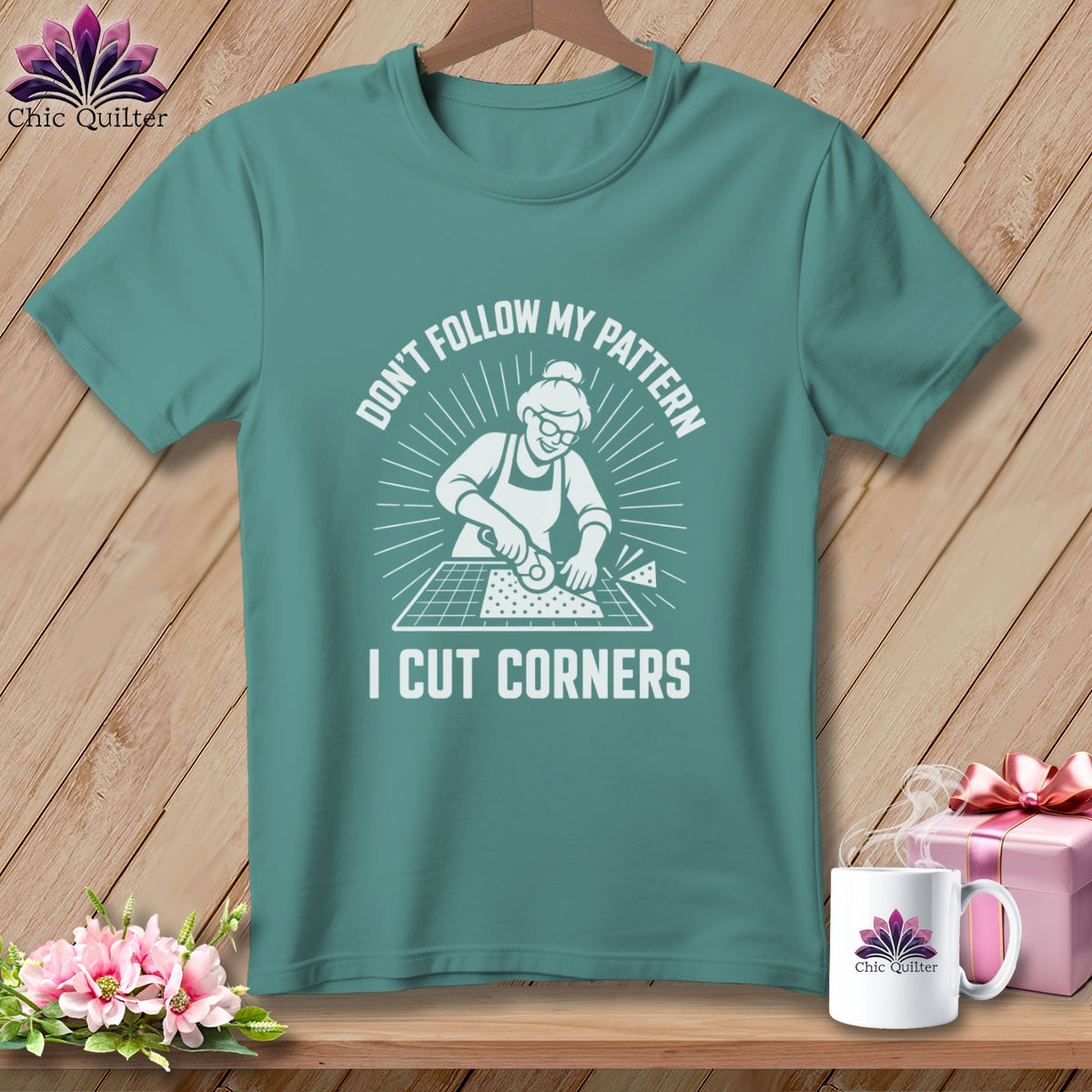 Teal t-shirt with "Don't Follow My Pattern I Cut Corners" graphic.