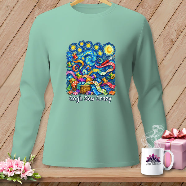 Mint green long sleeve shirt with "Gogh Sew Crazy" graphic of fabric scraps and spools.