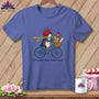 Penguin on a bicycle with fabric rolls and the text "off to buy fabric I don't need".