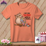 T-shirt with owl holding quilt pieces and text 