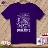 Purple t-shirt with graphic of a winding quilt road and text 