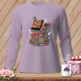 Long-sleeve purple shirt with a whimsical illustration of a house made of books and fabric scraps.
