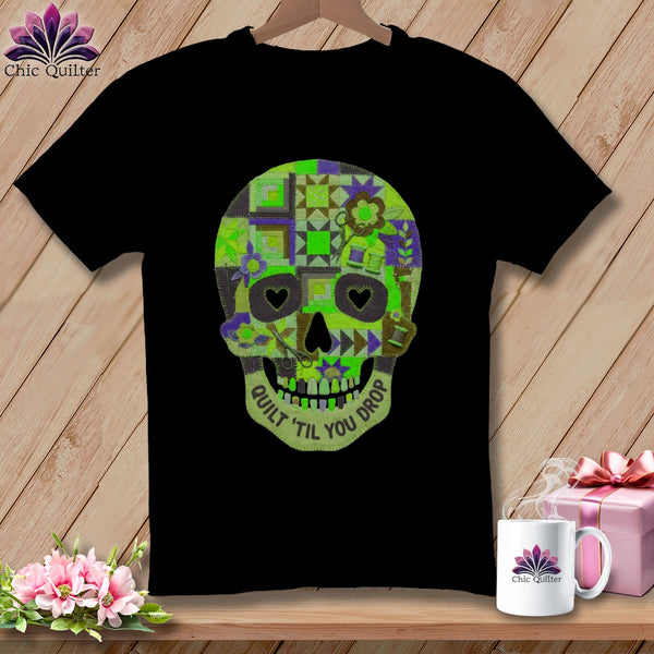 Black t-shirt with a quilted skull design and "Quilt 'Til You Drop" text.