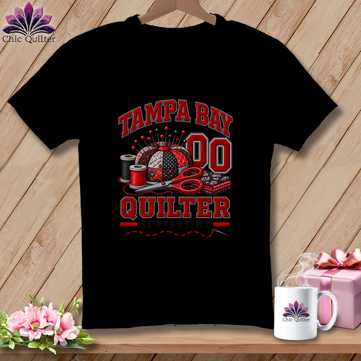 Black t-shirt featuring Tampa Bay Quilter text, a pincushion, thread spools, and scissors design.