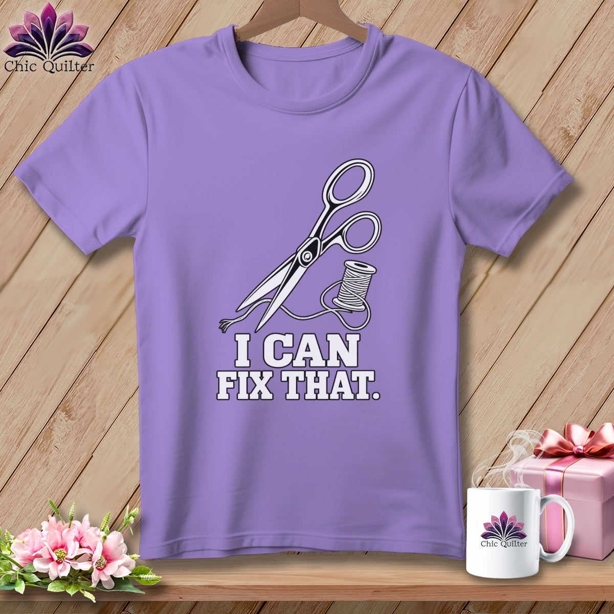 Purple t-shirt with scissors, thread, and "I CAN FIX THAT." text.