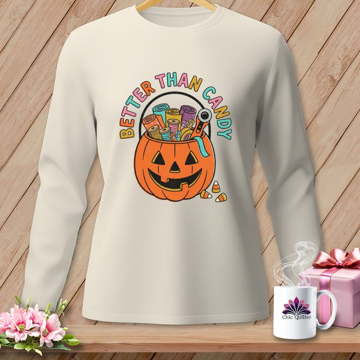 Long sleeve shirt with jack-o'-lantern basket filled with sewing supplies and "Better Than Candy" text.
