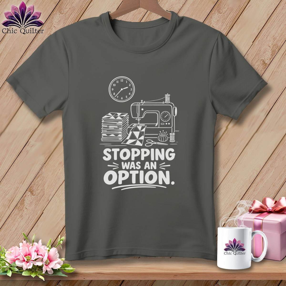 Dark gray t-shirt with a sewing machine, fabric stack, and "Stopping Was An Option" text.