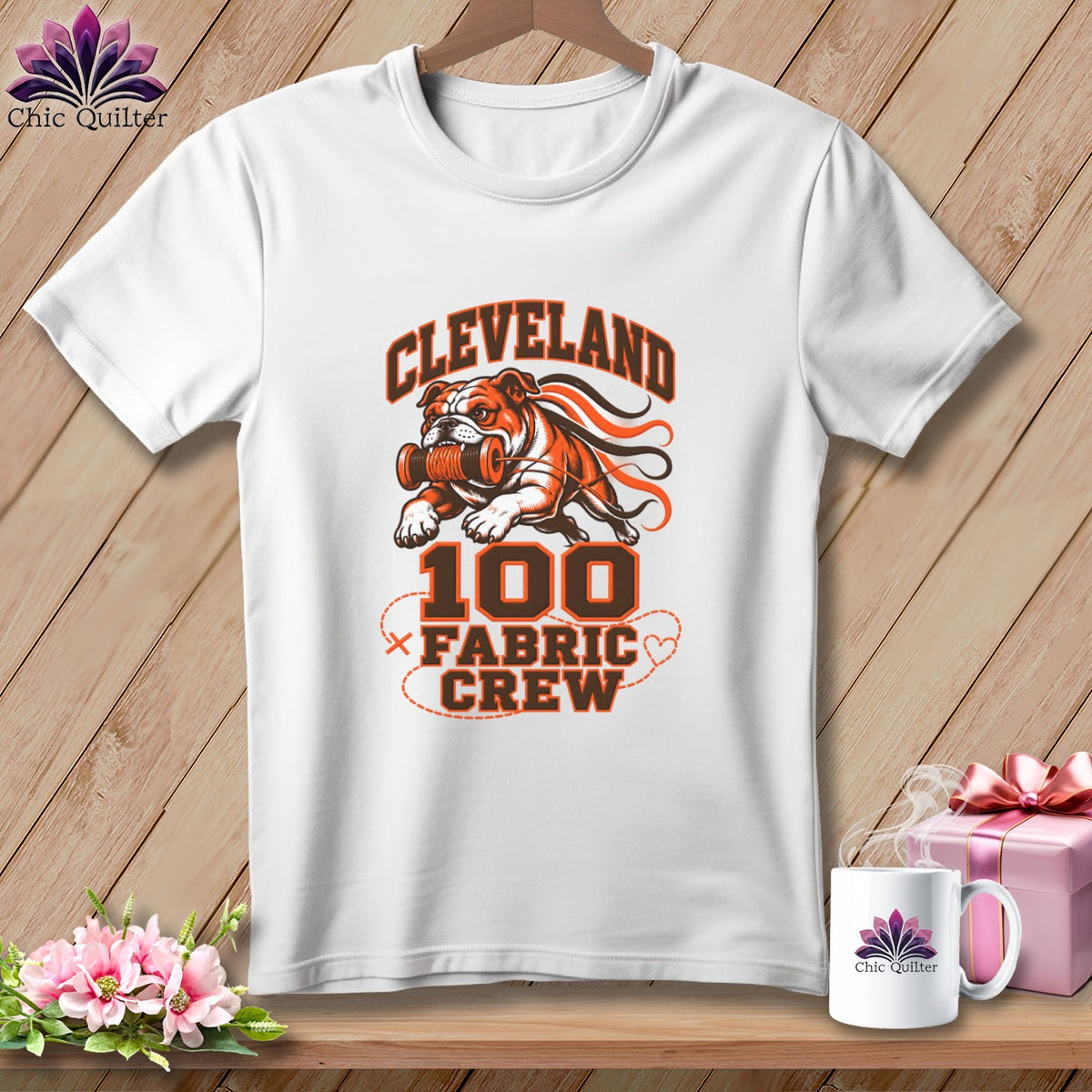 White crewneck t-shirt featuring a Cleveland 100 Fabric Crew graphic with a bulldog holding a spool of thread.