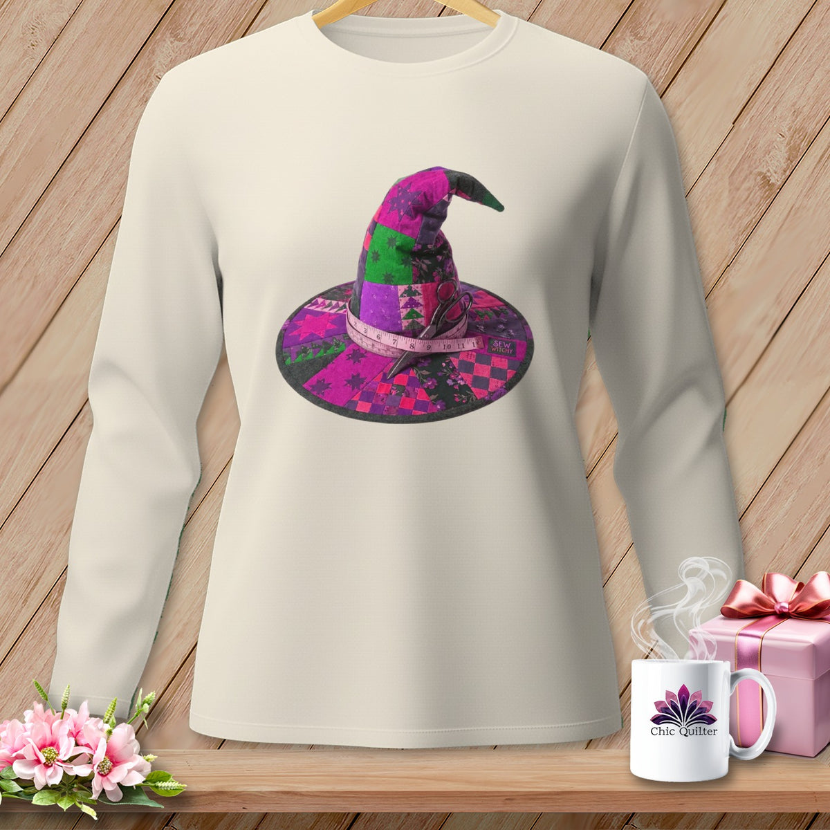 Long-sleeved shirt with a patchwork witch hat graphic and "Sew Witchy" text.