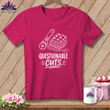 Pink t-shirt with graphic of rotary cutter and fabric stacks, text reads 