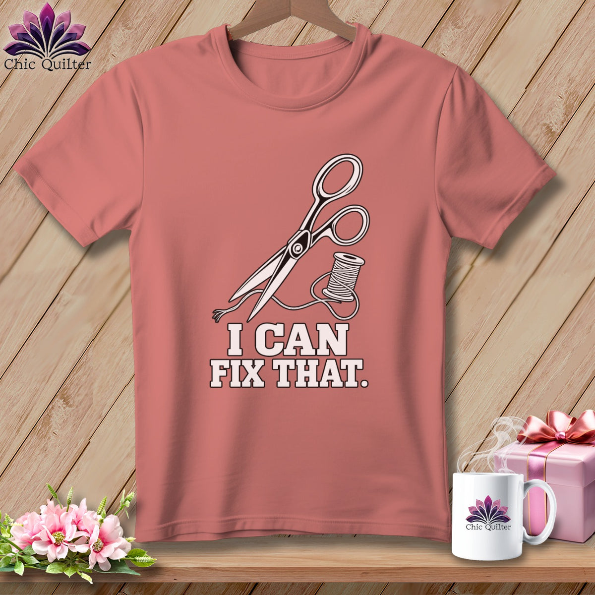 Pink t-shirt with scissors, thread, and text "I CAN FIX THAT."