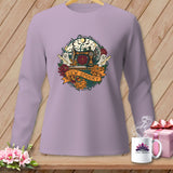 Purple long-sleeve shirt with a circular Halloween-themed graphic featuring a sewing machine and 