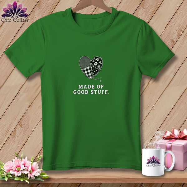 Green t-shirt with a patchwork heart design and "Made of Good Stuff" text.