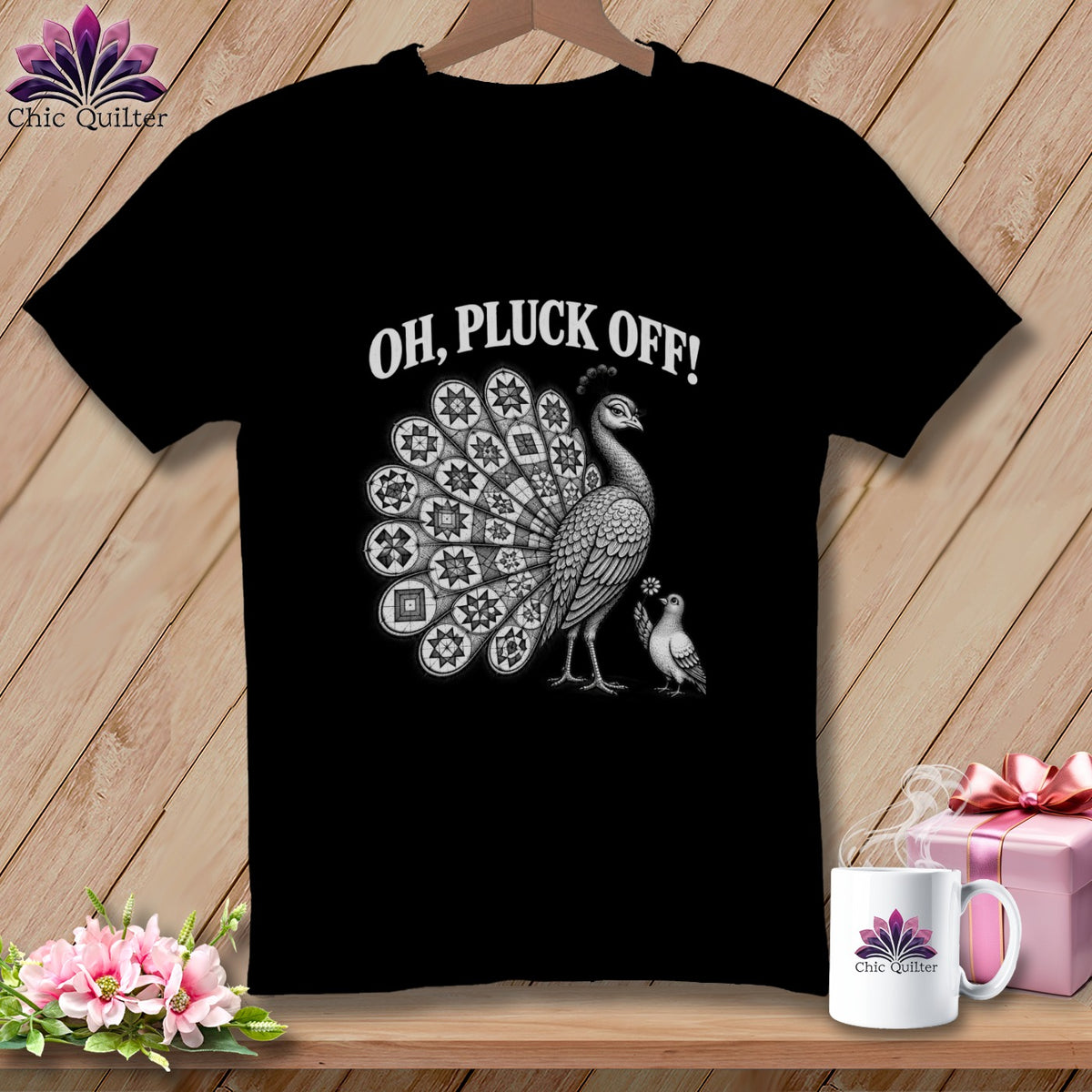 A black t-shirt features a white illustration of a peacock with a patchwork tail and the text "OH, PLUCK OFF!"