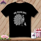 A black t-shirt features a white illustration of a peacock with a patchwork tail and the text 
