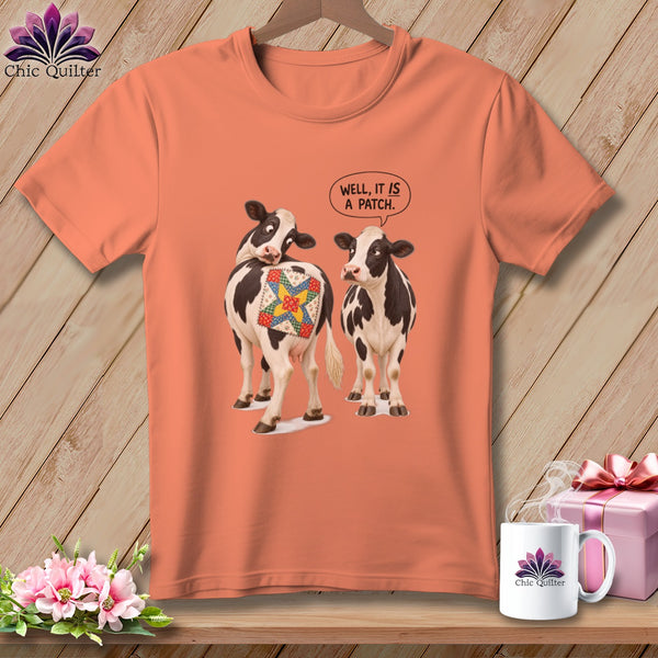 T-shirt with two cows, one with a quilted patch on its back, saying "WELL, IT IS A PATCH."