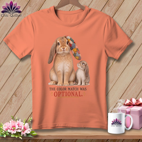 Peach t-shirt with two rabbits and text: "THE COLOR MATCH WAS OPTIONAL."