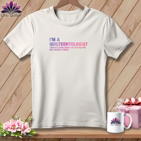 White t-shirt with "I'm a Quilteontologist" text, floral accents.