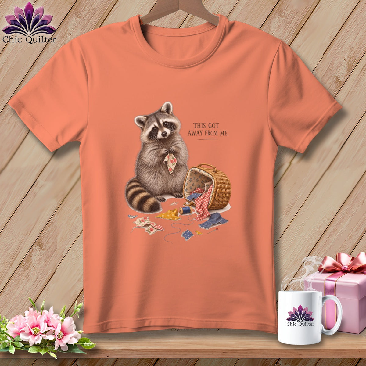 Peach t-shirt with raccoon, sewing basket, and text "This Got Away From Me."