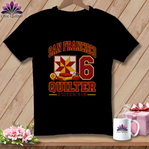 A black t-shirt features a San Francisco Quilter graphic with a quilt block and the number 6.