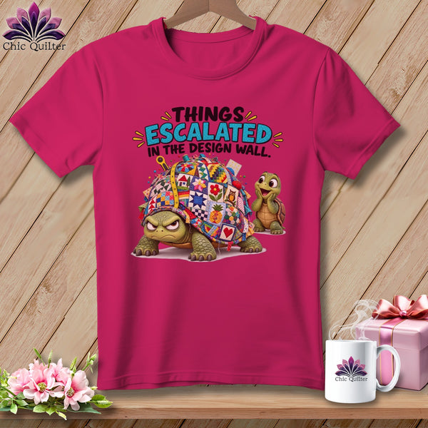 Fuchsia t-shirt with cartoon turtles and text "THINGS ESCALATED IN THE DESIGN WALL."