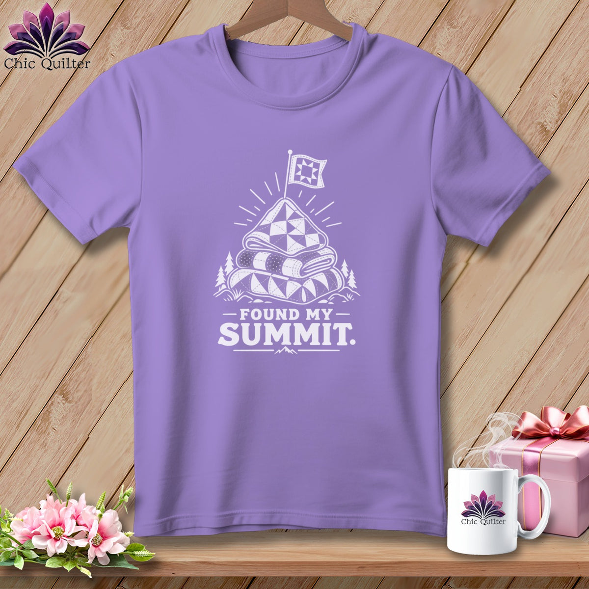 Purple t-shirt with "Found My Summit" graphic featuring stacked quilts and a flag.