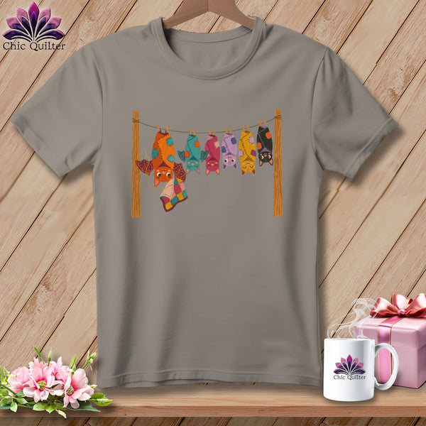T-shirt with colorful bats hanging from a clothesline.