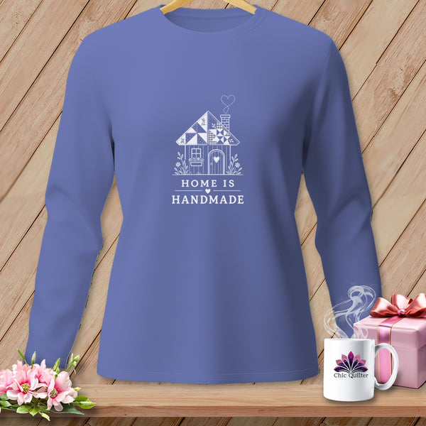 Purple long-sleeve shirt with a white graphic of a house and the text "HOME IS HANDMADE."