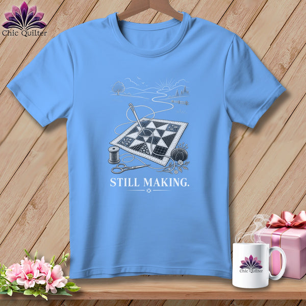 Light blue t-shirt with quilting graphic and text "STILL MAKING."