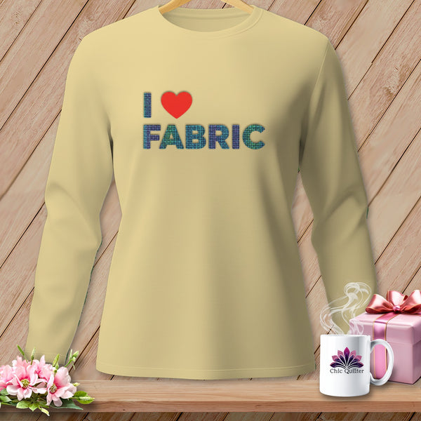 Light yellow long-sleeve shirt with "I ❤️ FABRIC" text in plaid and heart graphics.
