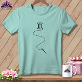 Light blue t-shirt with spool of thread and needle graphic.