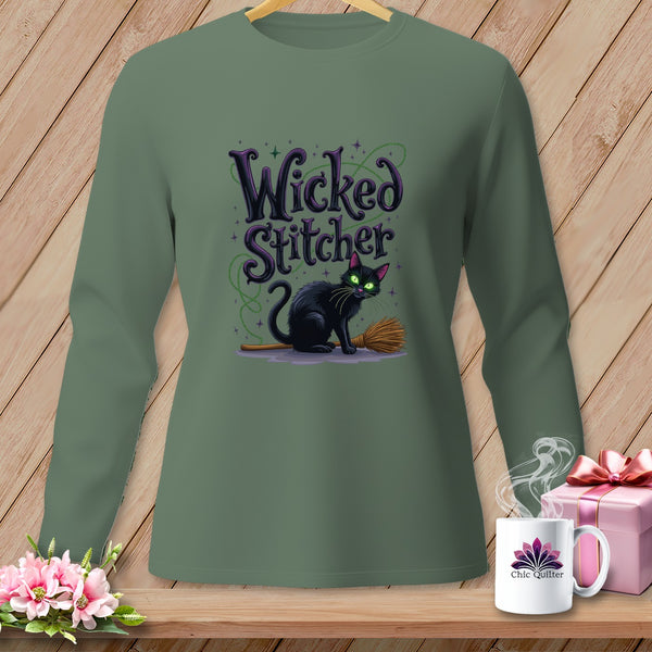 Green long-sleeved shirt with a black cat and broom graphic that reads "Wicked Stitcher".