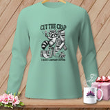 Mint long sleeve shirt with raccoon graphic and text 