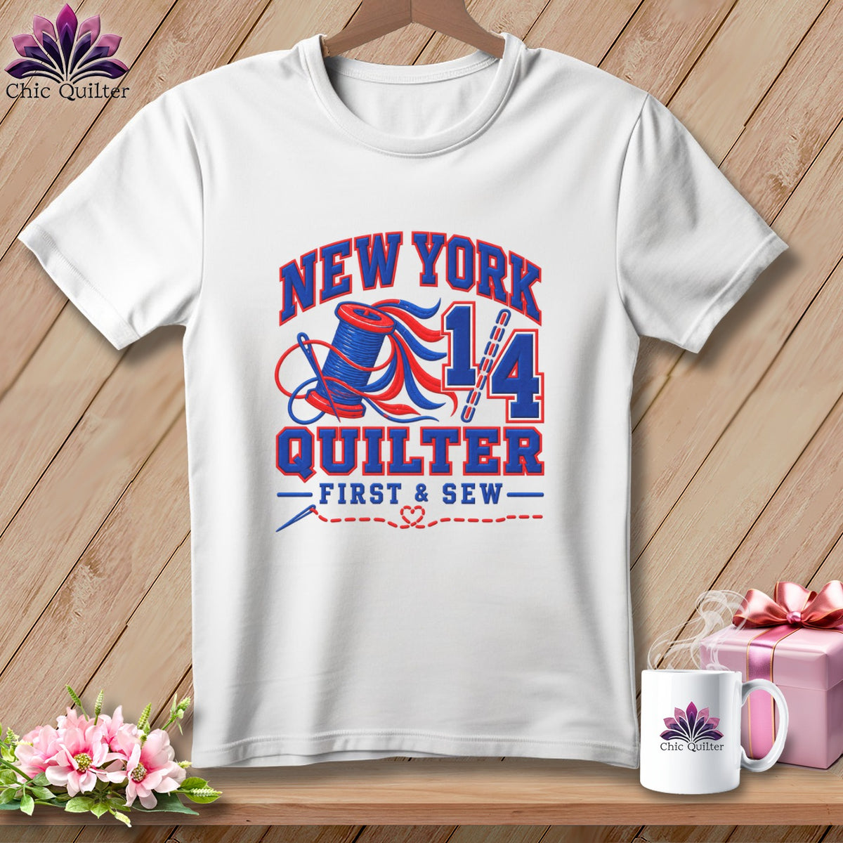 White t-shirt with a blue and red graphic featuring the text New York Quilter 14.