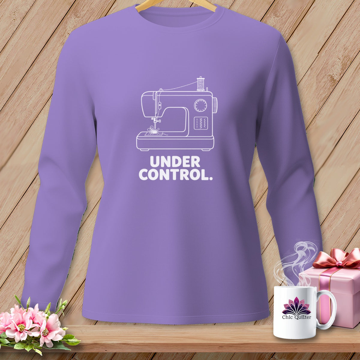 Purple long-sleeve shirt with white sewing machine graphic and "UNDER CONTROL." text.